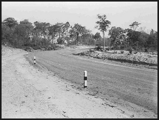 A view of the road as it skirts around an escarpment.