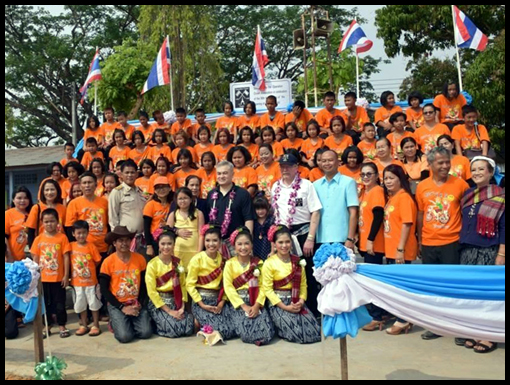 The children and teacher in one group shot and all the VIP's in the other.