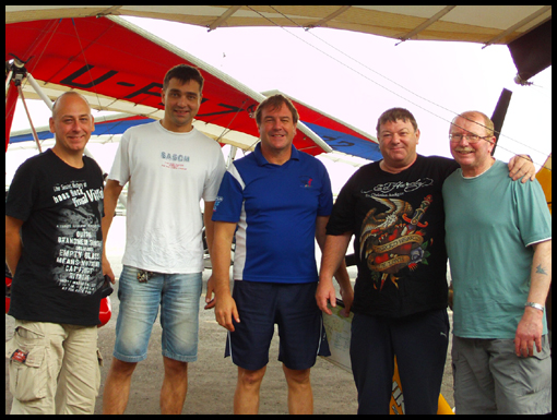 The Nong Prue flyers pose in front of their aircraft.