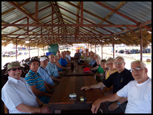 The group seated for the meal and an image of Mark Wareham riding the Jet Ski