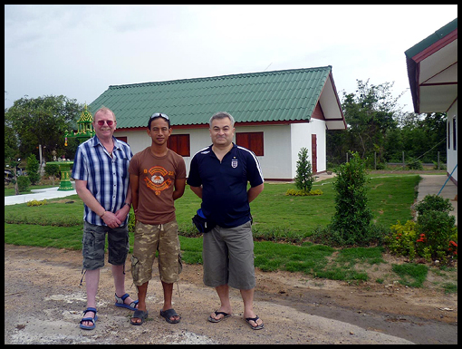 Sgt Presha of the Royal Thai Engineers poses with Noel jackson and John Hamnett in front of the staff quarters on Crown Airfield.