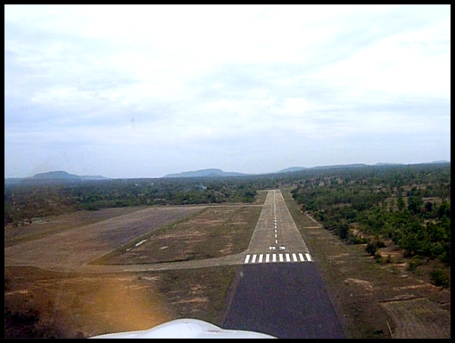 The view from the cockpit of runway 03 on finals approach.