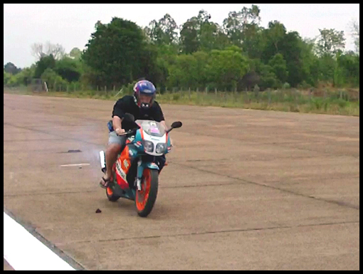 Noel jackson speeds down the Crown Airfield runway on his motorbike.