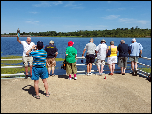 At the Pattaya Noi visitor center the group observe the miriads of fish.