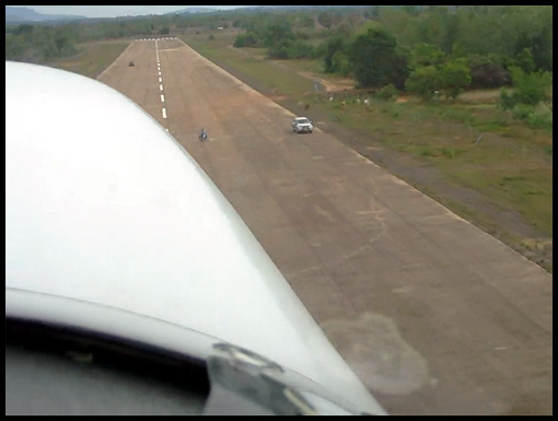 A aerial view of the runway from the cockpit on take-off.