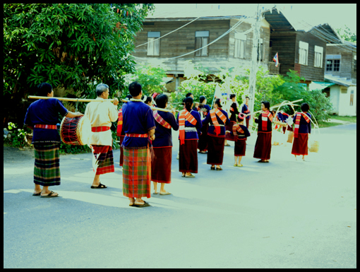 The travellers a escorted into the village square.