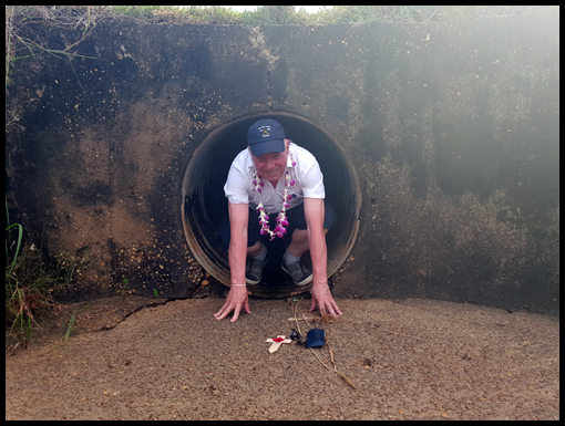 Malcolm MacMillan having fun in a culvert he worked on fifty years ago.