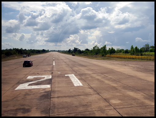 A shot of runway21 and the group pose for a picture beside the plaque at Nong Phoc Police Station.