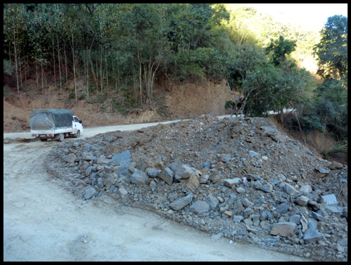 Bad road in Laos and Hmong girls. (rollover)