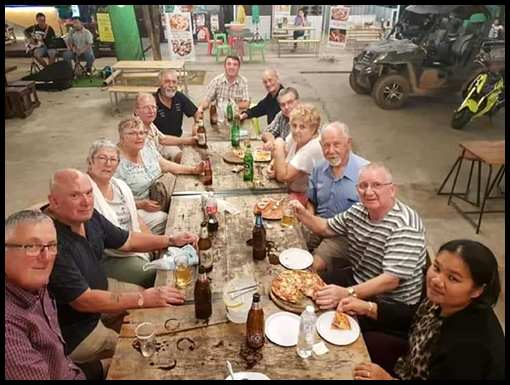 The travellers eat dinner at a food court near to the River Front hotel Mukdahan.