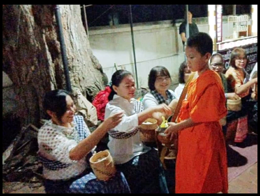 The Monks walk through the streets of Luang Prabang collecting alms.