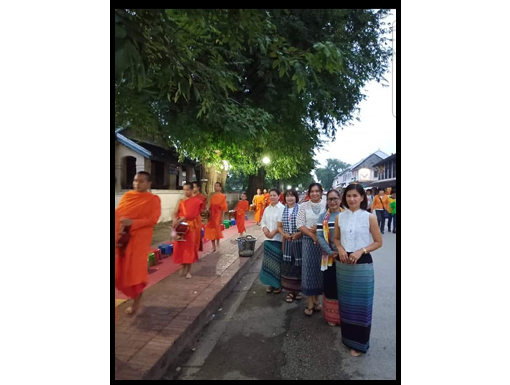 Sai-baht over and the group wait for the pickup to go to the market.