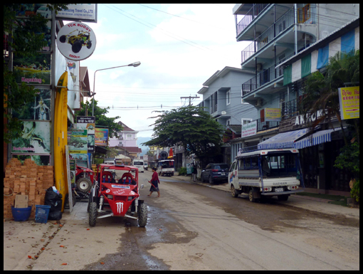 The narrow main thoroughfare running north to south in Vang Vieng.