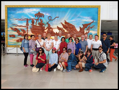 The trasvellers take a group shot in the Foyer of the Wattay Airport.