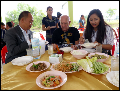 Jimmy James sits with the LNT school headmaster and Miss Chatpimol