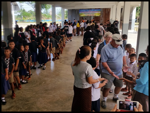 The children form a farewell corridor.