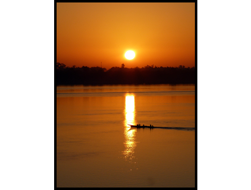 The sun rises over the Mekong and Aek's gifts are given to his friends.