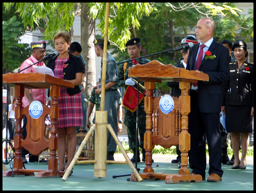 Mike Chapman and translator Ms Thom preside over the 2014 Remembrance Ceremony.