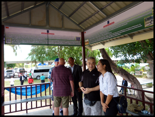 The OCA visitors peruse the shelter information boards.