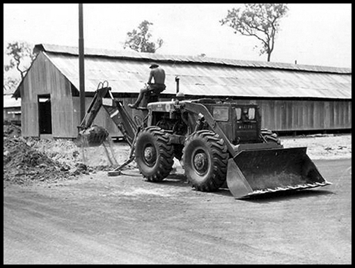 Graham Large works with a Michigan 75 with Sherman Backhoe on the monsoon drains at Crown Camp.