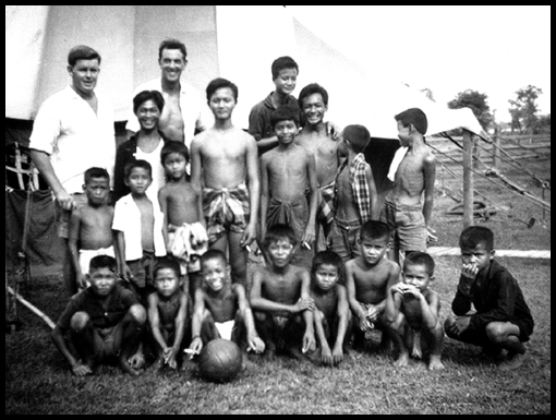 Jeremy and 'Les' stand for a picture with their footballing friends.