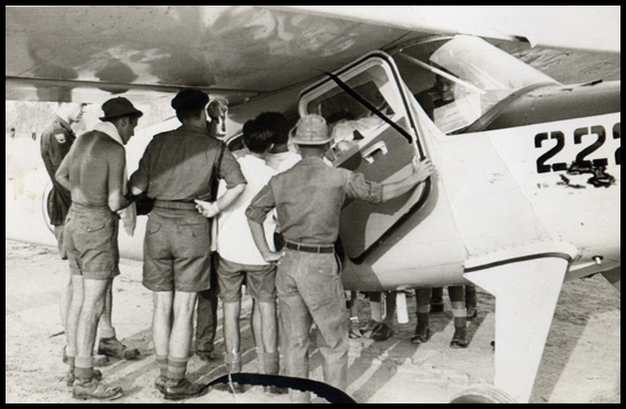 Medics lift John Crouch into the plane for Casevac