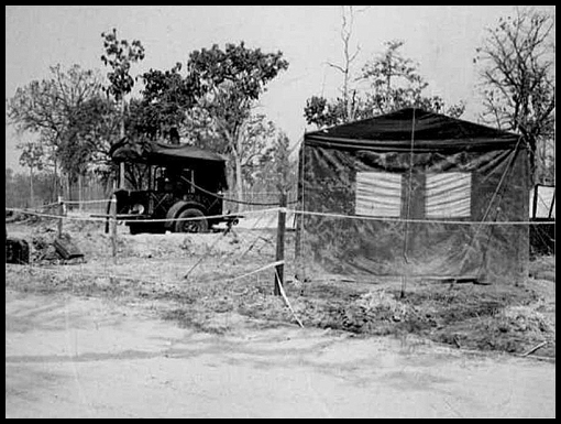 The Crown tented camp shower unit and hutted camp RAOC stores.